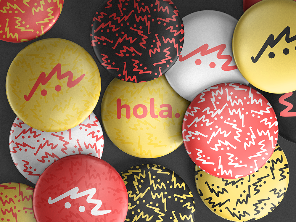 pins de multiples colores con el logo de branding